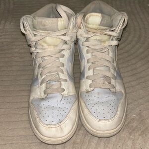 Baby blue and white nike high top dunks.
